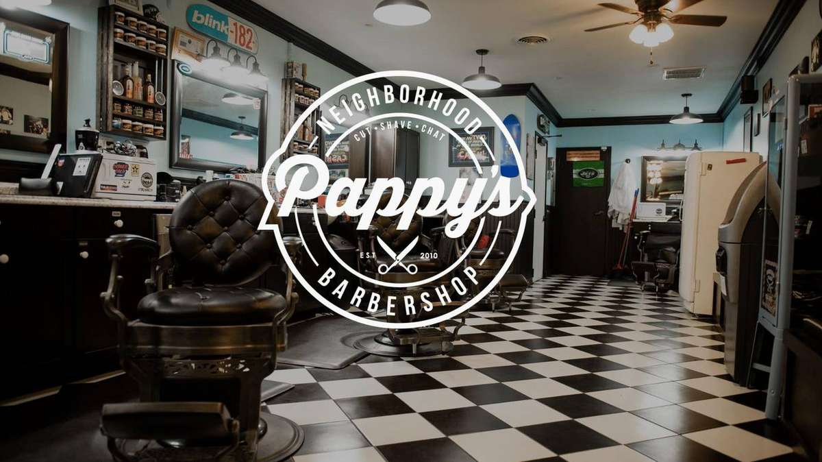 Vintage barber chairs on the checkerboard floor at Pappy's Barber Shop